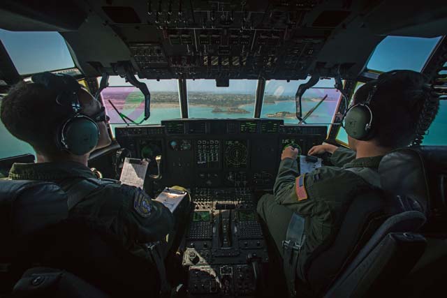 U.S. Air Force Capts. Lindsey Kinsinger and Chad Thompson, both pilots assigned to the 37th Airlift Squadron, fly over the coast of Normandy, France, June 3. 