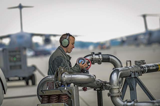 Staff Sgt. Adam Hart, 721st Aircraft Maintenance Squadron electrical and environmental systems specialist, disconnects a refueling pump from a C-17 Globemaster III before a flight to Bulgaria June 20 on Ramstein.  