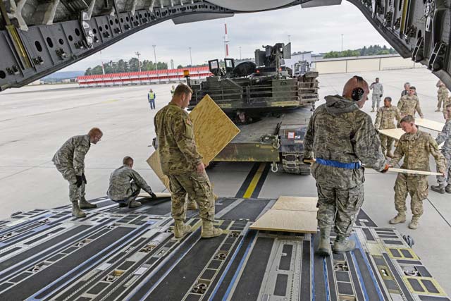 Airmen and Soldiers worked together to load two M1A2 Abrams main battle tanks onto the aircraft over a span of two days. 