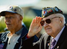 A World War II veteran salutes during "The Star-Spangled Banner" during a ceremony at the Picauville 9th Air Force monument June 4 in Normandy, France. More than 380 service members from Europe and affiliated D-Day historical units participated in the 71st Anniversary as part of Joint Task Force D-Day 71.