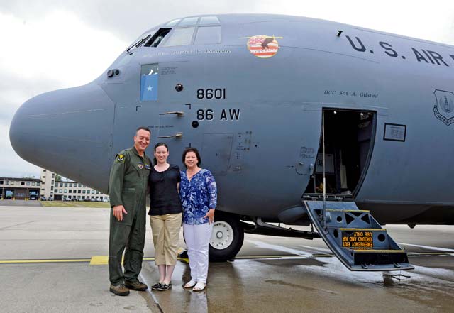 Brig. Gen. Patrick X. Mordente, 86th Airlift Wing commander, takes a photo with his daughter, Catherine, and wife, Marissa, after his final flight June 10 on Ramstein. Marissa marshalled Mordente’s C-130J Super Hercules in, where he was greeted by friends, family and Airmen. Mordente has led six groups and 27 squadrons as the wing commander since June 2013.