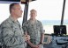 Photo by Airman 1st Class Tryphena Mayhugh<br>Brig. Gen. Patrick X. Mordente, 86th Airlift Wing commander, demonstrates to Chief Master Sgt. of the Air Force James A. Cody the different aspects of Ramstein Air Base from the control tower June 15. An all-call with Cody was held during his visit to give Airmen an opportunity to ask him questions about Air Force policies.