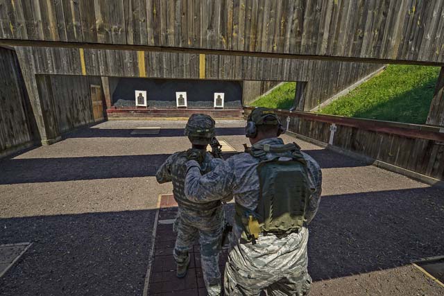 A Creek Defender instructor prepares the firing line during live-fire, stress-fire training June 18 on Baumholder.  The firing line is cleared by an instructor to ensure the students are safe when firing. 