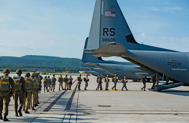 Photo by Senior Airman Damon Kasberg  Paratroopers from multiple allied countries enter a C-130J Super Hercules during International Jump Week July 7 on Ramstein.