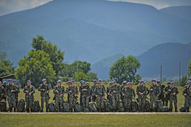 Bulgarian air force paratroopers stand in line after an airdrop at Krumuvo Air Base, Bulgaria. U.S. and Bulgarian forces performed daily airdrops during a two-week bilateral training exercise over Plovdiv, Bulgaria. More than 100 service members from Ramstein deployed to Plovdiv for the bilateral NATO exercise to enhance joint readiness while building interoperability capabilities.