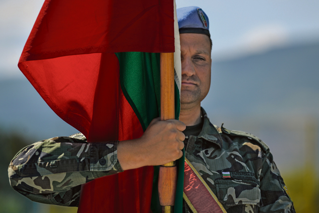 A Bulgarian airman holds the Bulgarian national flag during a salute to Nikolay Nankov Nenchev, Republic of Bulgaria minister of defense, July 16 at Krumuvo Air Base, Bulgaria. The U.S. is committed to supporting Bulgaria’s continued integration into NATO as an important member of the alliance.