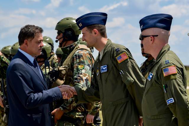 Nikolay Nankov Nenchev, Republic of Bulgaria minister of defense, shakes the hand of Capt. Derek Patrick, 37th Airlift Squadron pilot and exercise mission commander, at Krumuvo Air Base, Bulgaria, July 16. The U.S. Air Force’s forward presence in Europe allows us to build new and deeper partnerships across the continent.
