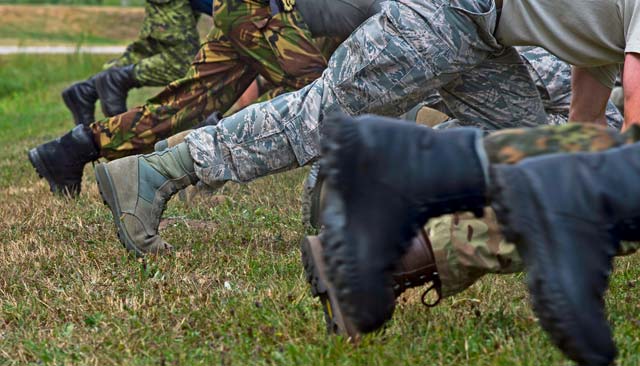 Officers from NATO countries perform mountain climbers while training with the 435th Security Forces Squadron. The officers were visiting Ramstein as part of the International Junior Officer Leadership Development Course.