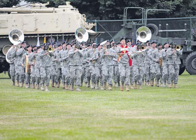 The U.S. Army Europe Band performs traditional martial and patriotic airs during the 21st TSC change-of-command ceremony held June 24 at NCO Field on Daenner Kaserne in Kaiserslautern.