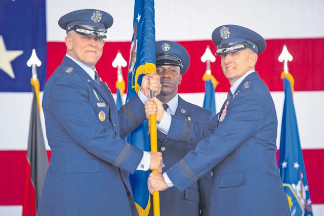 Photo by Senior Airman Nicole Sikorski Lt. Gen. Timothy M. Ray, 3rd Air Force and 17th Expeditionary Air Force incoming commander, takes the guidon from Gen. Frank Gorenc, U.S. Air Forces in Europe and U.S. Air Forces Africa commander July 2 on Ramstein. It is military tradition that a guidon is exchanged between commanders, symbolizing the passing of  command.