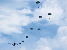 Photo by Staff Sgt. Leslie Keopka
Paratroopers exit a C-130J Super Hercules during International Jump Week near Alzey, Germany, July 7. During jump week, more than 200 U.S. and allied partners disembarked their designated airframes to strengthen skills and tactics while building and strengthening international relations with counterparts.
