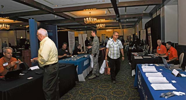 Airmen and civilians attend the Armed Forces Communications-Electronics Association’s technology exposition July 20 on Ramstein. Over 65 companies participated in the two-day event to show the technologies available that may aid the military in completing their mission.