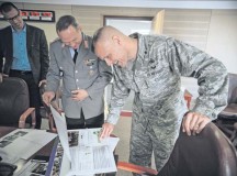 German Armed Forces Lt. Col. Michael Brendel, Leadership Development and Civic Education Center Koblenz senior civil servant (left), shows training slides to Brig. Gen. Bradley Spacy, U.S. Air Forces in Europe and Air Forces Africa director of Logistics, Installations and Mission Support and Diversity and Inclusion Council chair, during a Diversity and Inclusion Council meeting June 26 on Ramstein.