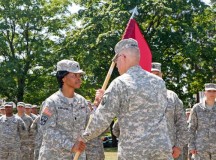 Photo by Lt. Col. Jefferson Wolfe
Army Lt. Col. Bidemi Y. Olaniyi-Leyimu (left), Medical Support Unit-Europe incoming commander, receives the unit guidon from Brig. Gen. Arlan M. DeBlieck, commander of the 7th Civil Support Command, during a ceremony held July 11 on the Daenner Kaserne parade field. The passing of the guidon is a tradition symbolizing the changing of command.