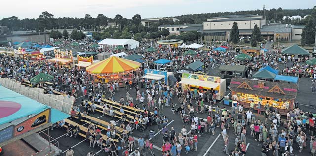Patrons of Freedom Fest partake in rides, games and food July 4 on Ramstein. Attendees were also able to enjoy fireworks and live concerts.