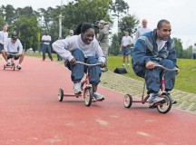 Photo by Tech. Sgt. Daylena S. Ricks
Tricycle riders catch up to their partners at the tricycle relay race during Resilience Day Sept. 11, 2014 on Ramstein. This year's Resilience Day featured a Commander's Challenge compiled of athletic events to challenge Airmen.