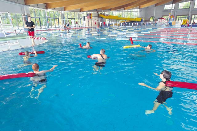 Photos by Staff Sgt. Sharida Jackson Andrew Broadwater, 86th Force Support Squadron recreational specialist (left middle ground), instructs participants during a lifeguard course Aug. 11 on Ramstein. The weeklong course included classroom and hands-on training in drowning victim rescue, CPR and first aid.