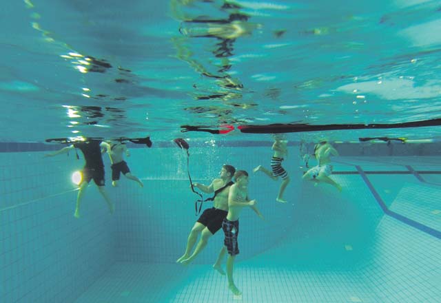 Luke Sobczak (center left) rescues a simulated victim during a lifeguard course Aug. 11 on Ramstein. Upon successful completion of the lifeguard course, participants receive an American Red Cross Lifeguard certificate.