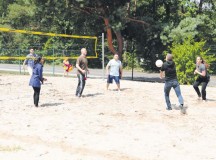 Religious affairs specialists from across the Kaiserslautern area play a game of volleyball during an anniversary celebration of the Chaplain Corps July 29 on Pulaski Barracks.