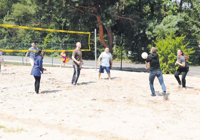 Religious affairs specialists from across the Kaiserslautern area play a game of volleyball during an anniversary celebration of the Chaplain Corps July 29 on Pulaski Barracks.