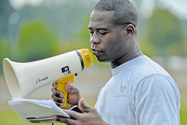 Tech. Sgt. Justin Seals, Kisling NCO Academy Instructor, reads directions before an obstacle course. The Royal Air Force Air Training Corps cadets visited the NCOA for a chance to see how the U.S. Air Force operates in Germany.