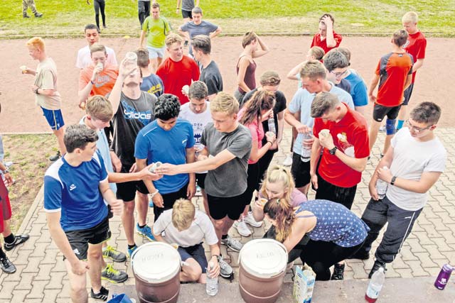 Royal Air Force Air Training Corps cadets drink water after an obstacle course Aug. 10 on Vogelweh. The cadets completed four rounds of tire flips, football drills, speed work and sprints during the course hosted by the Kisling NCO Academy.