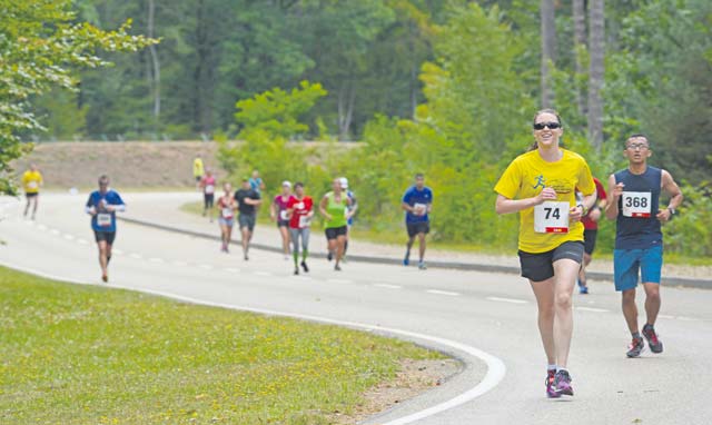 Photos by Airman 1st Class Tryphena Mayhugh KMC members run the last quarter mile of the 86th Force Support Squadron’s annual Ramstein Half Marathon Aug. 15 on Ramstein. The 341 participants who signed up for the event ran 13.1 miles and received a T-shirt, cinch bag and participation medal.