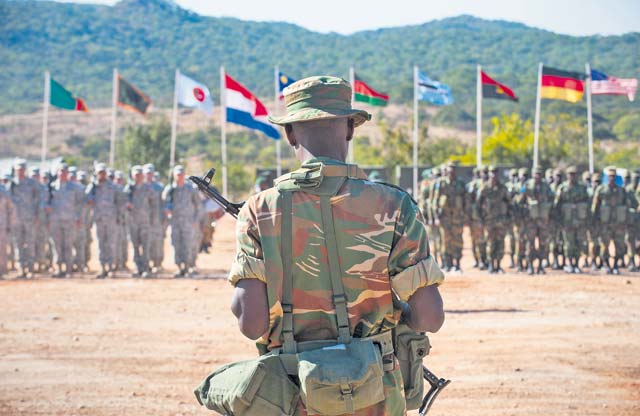 A member of the Zambian Defense Force prepares to assume command of a U.S. Army and Zambian defense formation during the opening day ceremony for Southern Accord 15 Aug. 4 in Lusaka, Zambia.