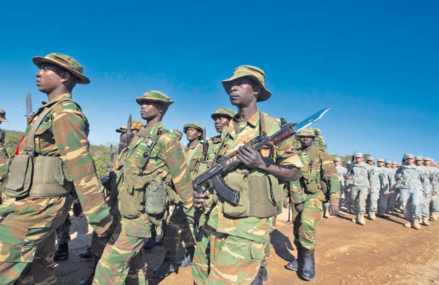 Members of the Zambian Defense Force march alongside U.S. Army Soldiers during the opening day ceremony for Southern Accord 15 Aug. 4.