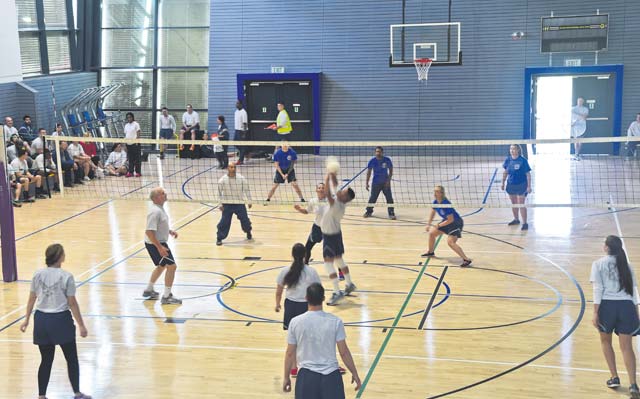 Photo by Staff Sgt. Travis Edwards An Airman sets a volleyball during an intramural Commander’s Challenge match Sept. 11, 2014 on Ramstein. The Commander’s Challenge was a friendly competition that put Airmen against Airmen to see who would leave with the first place trophy.