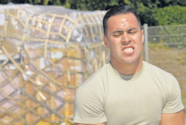 Senior Airman Arturo Anchondo, 721st Aerial Port Squadron ramp services specialist, participates in the obstacle course portion of the rodeo.
