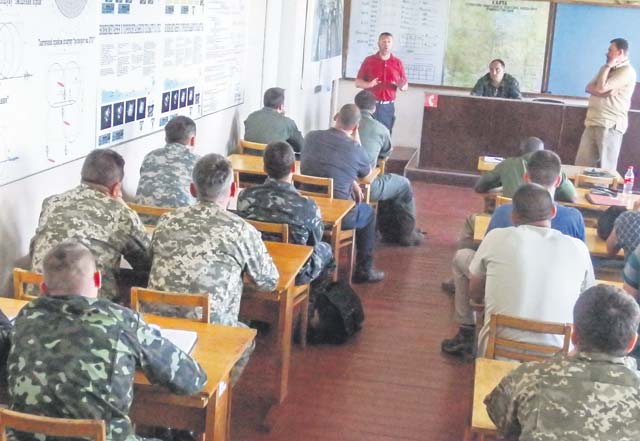 Courtesy photo U.S. Air Force Tech. Sgt. George Broom, 435th Air Mobility Squadron airfield manager, briefs Ukrainian personnel at Staro-Konstantinov Air Base, Ukraine as part of the airfield assessments carried out by the 435th Contingency Response Group July 12 to 20.