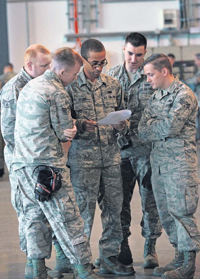 Members of the 721st Aerial Port Squadron passenger services team complete the knowledge test during the rodeo.