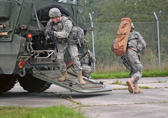 Photo by Staff Sgt. Warren W. Wright Jr. Competitors from the 2nd Cavalry Regiment dismount a Stryker combat vehicle during a medical scenario exercise conducted as part of the 2015 European Best Warrior Competition Sept. 15 at the Grafenwoehr Training Area. About 22 candidates participated in the intense, annual weeklong competition, the most prestigious competitive event of the region. In the end, only one junior officer, one NCO and one Soldier emerged as “Best Warriors.”