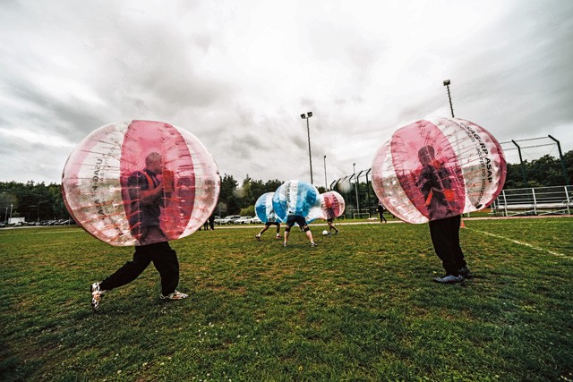 Photos by Senior Airman Nicole Sikorski Airmen and Soldiers play bubble soccer at the Combined Federal Campaign-Overseas kickoff Sept. 15 on Vogelweh. For the second year, the Air Force team won against the Army.