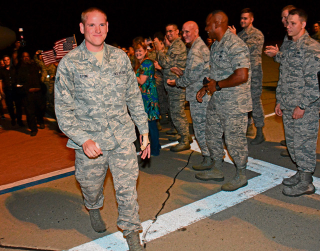 Photo by Tech. Sgt. James Hodgman Airman 1st Class Spencer Stone, the 86th Airlift Wing Airman who helped foil a terrorist attack on a train in France Aug. 21, arrives at Travis Air Force Base, Calif., Sept. 3. Stone was greeted by hundreds of Airmen including Col. Joel Jackson, the 60th Air Mobility Wing commander, and Chief Master Sgt. Alan Boling, the 60th AMW command chief.