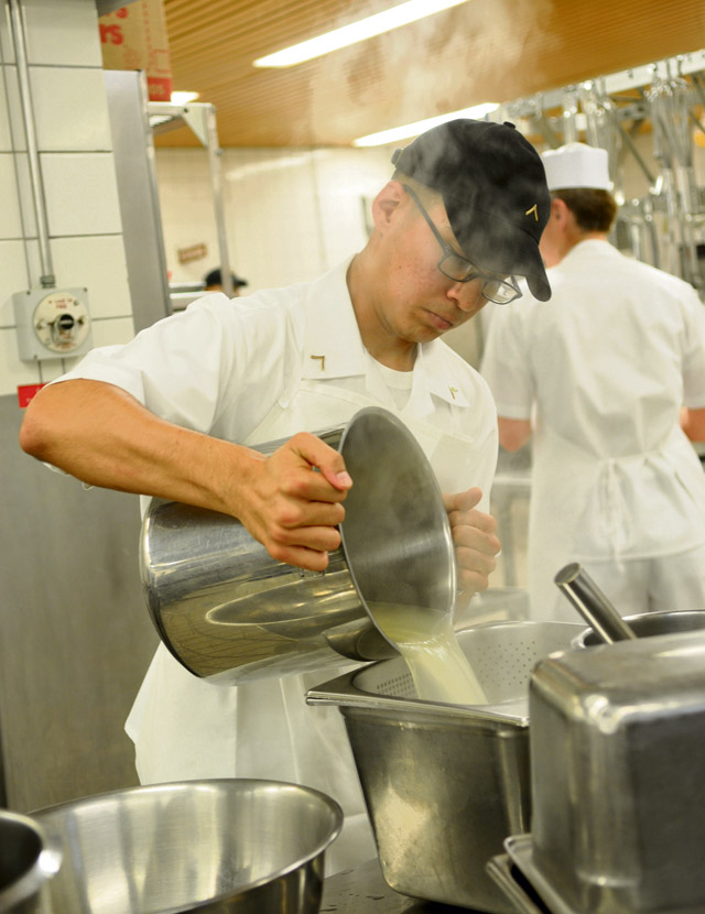 Pvt. Justin Quintana, 421st Multifunctional Medical Battalion drains noodles as part of his final meal preparation during the 21st TSC Culinary Warrior of the Year competition held Sep. 2 on Kleber Kaserne.