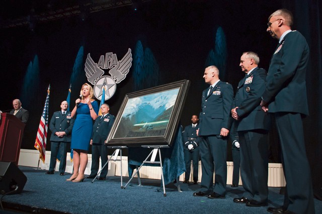 Air Force Secretary Deborah Lee James gives remarks during the unveiling ceremony of the painting “That Others May Live” during the Air Force Association Air and Space Conference and Technology Exposition. “That Others May Live” documents the rescue of Marcus Luttrell, a U.S. Navy SEAL, in June 2005 by reservists from the 920th Rescue Wing, Patrick Air Force Base, Fla. The well-known rescue was dramatized in the movie “The Lone Survivor.”