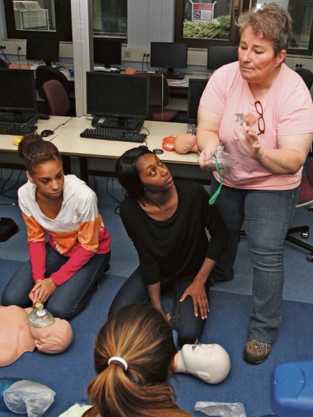 Jodie L. Richmond, a teaching nurse at Kaiserslautern High School (right), instructs nursing assistant candidates on techniques to treat victims in cardiac arrest during training for licensing as a Certified Nursing Assistant at Sept. 13 at Ramstein High School.