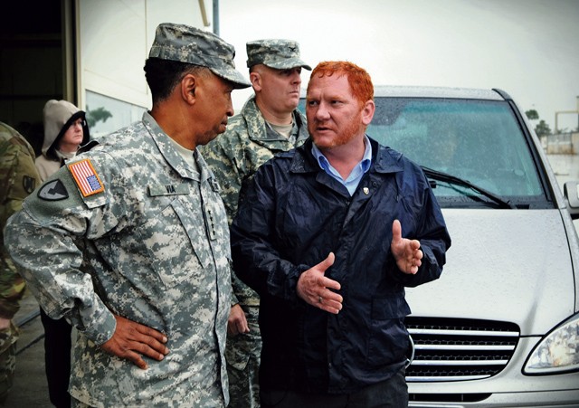 Gen. Dennis L. Via, commanding general of U.S. Army Materiel Command (left), listens as Robin Dothager, 405th Army Field Support Brigade’s theater prepositioned stocks manager (right), explains details about the European Activity Set, a brigade set of equipment maintained by the 405th AFSB for use by rotational forces. As the Army’s most senior officer responsible for equipping the force, Via visited sustainment and materiel sites throughout Europe this week to assess how AMC can most effectively support the U.S. Army in Europe. 