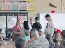 Photo by Matthew Katsaros
AVID Elective class
Landstuhl Elementary Middle School Advancement Via Individual Determination teacher Gariann Wrenchey and Principal Jason James congratulate student Edsel Costas and his parents Aug. 31 on joining the 2015-2016 AVID Elective class.