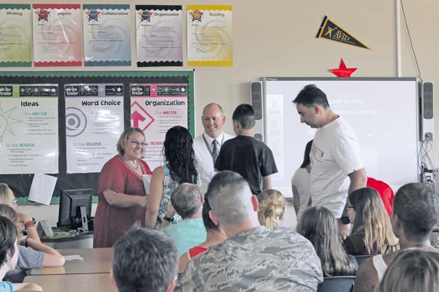 Photo by Matthew Katsaros AVID Elective class Landstuhl Elementary Middle School Advancement Via Individual Determination teacher Gariann Wrenchey and Principal Jason James congratulate student Edsel Costas and his parents Aug. 31 on joining the 2015-2016 AVID Elective class.