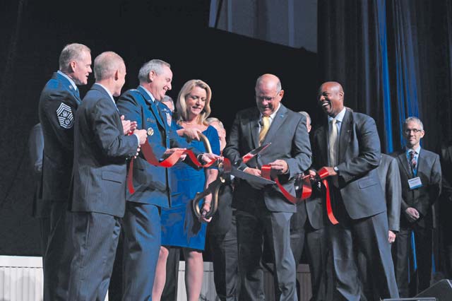 Photo by Staff Sgt. Whitney Stanfield Senior Air Force leaders cut a ribbon during the Air Force Association's Air and Space Conference and Technology Exposition in Washington, D.C. on Sept. 14. The ribbon-cutting ceremony kicked off the conference and opening of the exhibit hall.