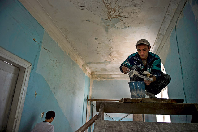 Roin, a Georgian engineer, prepares spackle holes in the ceiling of Public School No. 4 Aug. 27 in Gori, Georgia. Critical areas of the school were renovated by a team of U.S. Air Force engineers, 10 Georgian army engineers and a three-man U.S. Army Europe Civil Affairs team. Humanitarian and Civic Assistance projects enhance operational readiness of military personnel while providing support to the host nation's population.