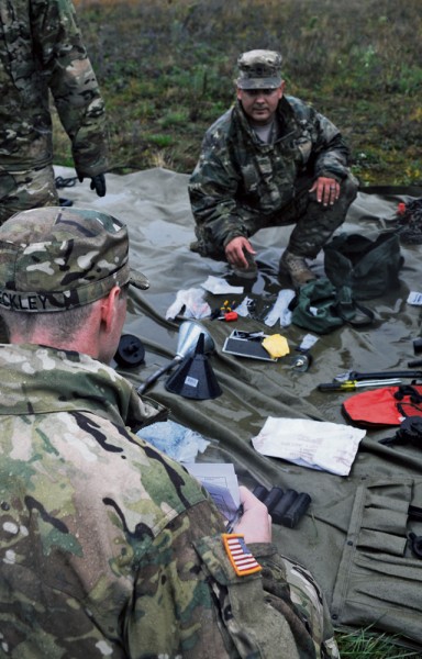 Soldiers of the 1st Brigade Combat Team, 3rd Infantry Division, inventory tools and equipment prior to drawing them from the European Activity Set Sept. 17 at Coleman Worksite.