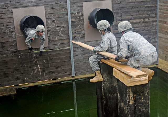 Photo by Staff Sgt. Warren W. Wright Jr. Officers, NCOs and Soldiers from across U.S. Army Europe navigate the leader reaction course during the 2015 European Best Warrior Competition Sept. 14 at the Grafenwoehr Training Area.