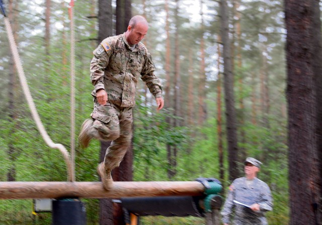 Photo by Staff Sgt. Warren W. Wright Jr. Sgt. 1st Class Elijah Howlett, 1st Squadron, 91st Cavalry Regiment, 173rd Airborne Brigade, Europe’s 2015 Best NCO Warrior, navigates an obstacle during the 2015 U.S. Army in Europe Best Warrior Competition held Sept. 13 to 18 at the Grafenwoehr Training Area.