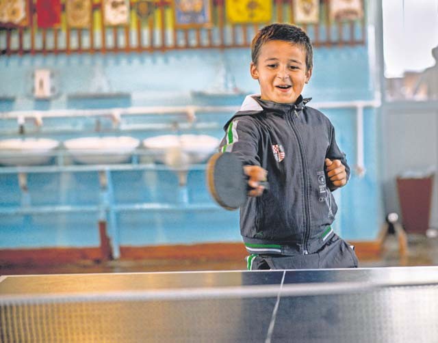 A Moldovan student plays pingpong Oct. 19 at Liceul Teoretic Alexei Mateevici School in Sanatauca, Moldova. Airmen from the 435th Construction and Training Squadron and the 52nd Civil Engineer Squadron worked on renovations at the school since Sept. 23. The renovations were part of the Moldova Humanitarian and Civic Assistance program as part of a military and civilian theater security cooperation program the U.S. European Command uses to directly impact civilian communities throughout 17 countries, primarily in Eastern Europe.