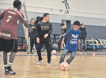 Elijah Muhammad, Ramstein Middle School student, dribbles the ball toward a goal during the KMC Adaptive Sports soccer event Oct. 15 on Vogelweh. Special needs students from Ramstein and Vogelweh middle and high schools had the opportunity to play soccer against each other and build camaraderie.