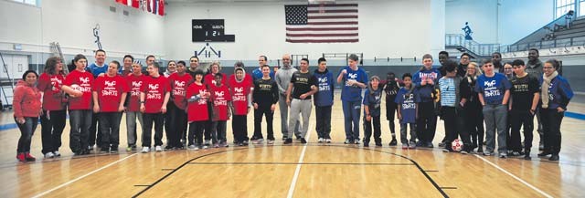 Students from Ramstein and Vogelweh middle and high schools pose for a group photo after participating in the KMC Adaptive Sports soccer event Oct. 15 on Vogelweh. The students had the opportunity to meet students from the other schools, play soccer and enjoy a barbecue together.